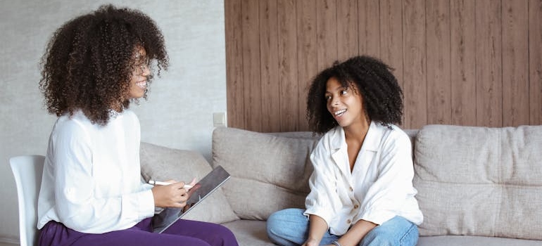 Woman talking to her therapist about eating disorders and substance abuse.