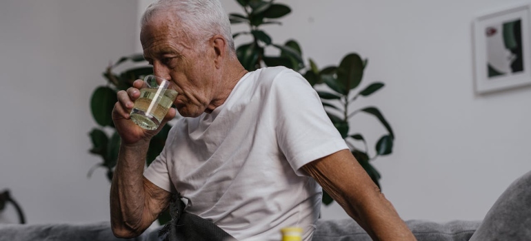 old man drinking water