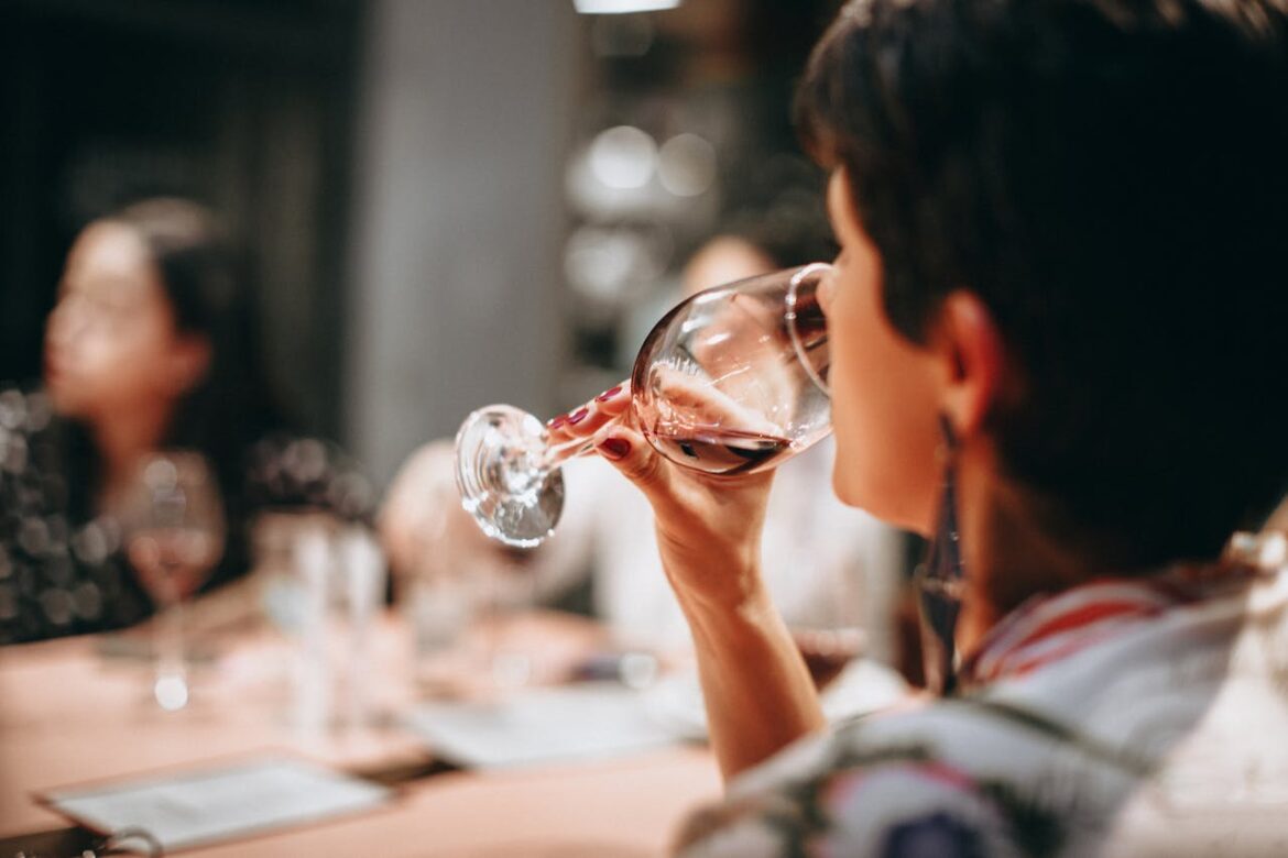 Woman drinking at a family function.