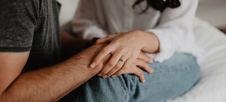 Couple holding hands.