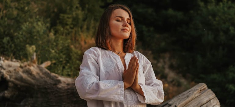 Woman practicing mindfulness outdoors as part of her relapse prevention plan.